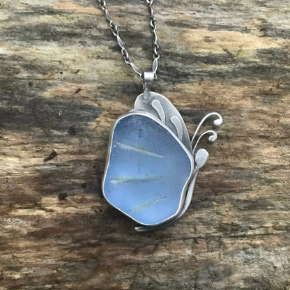 Blue sea glass butterfly pendant