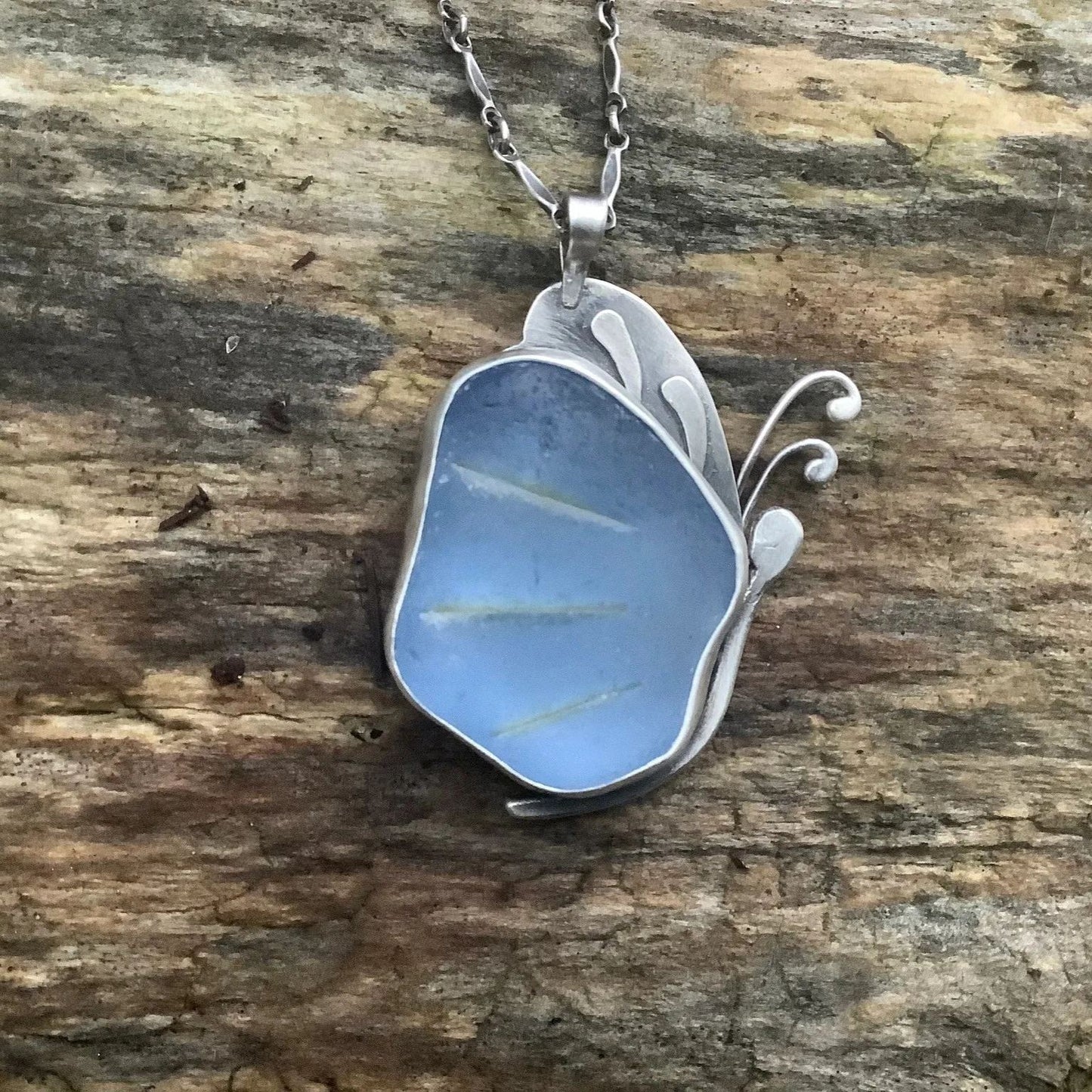 Blue sea glass butterfly pendant