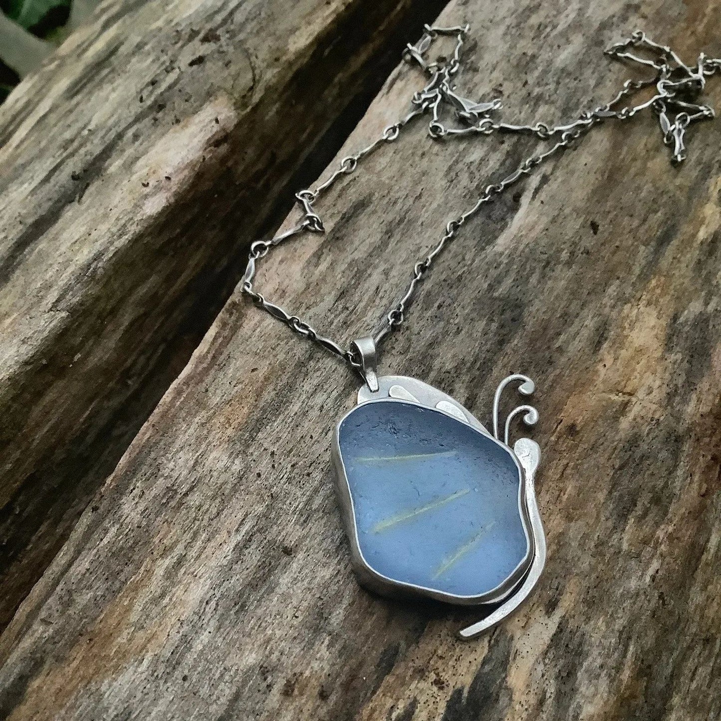 Blue sea glass butterfly pendant