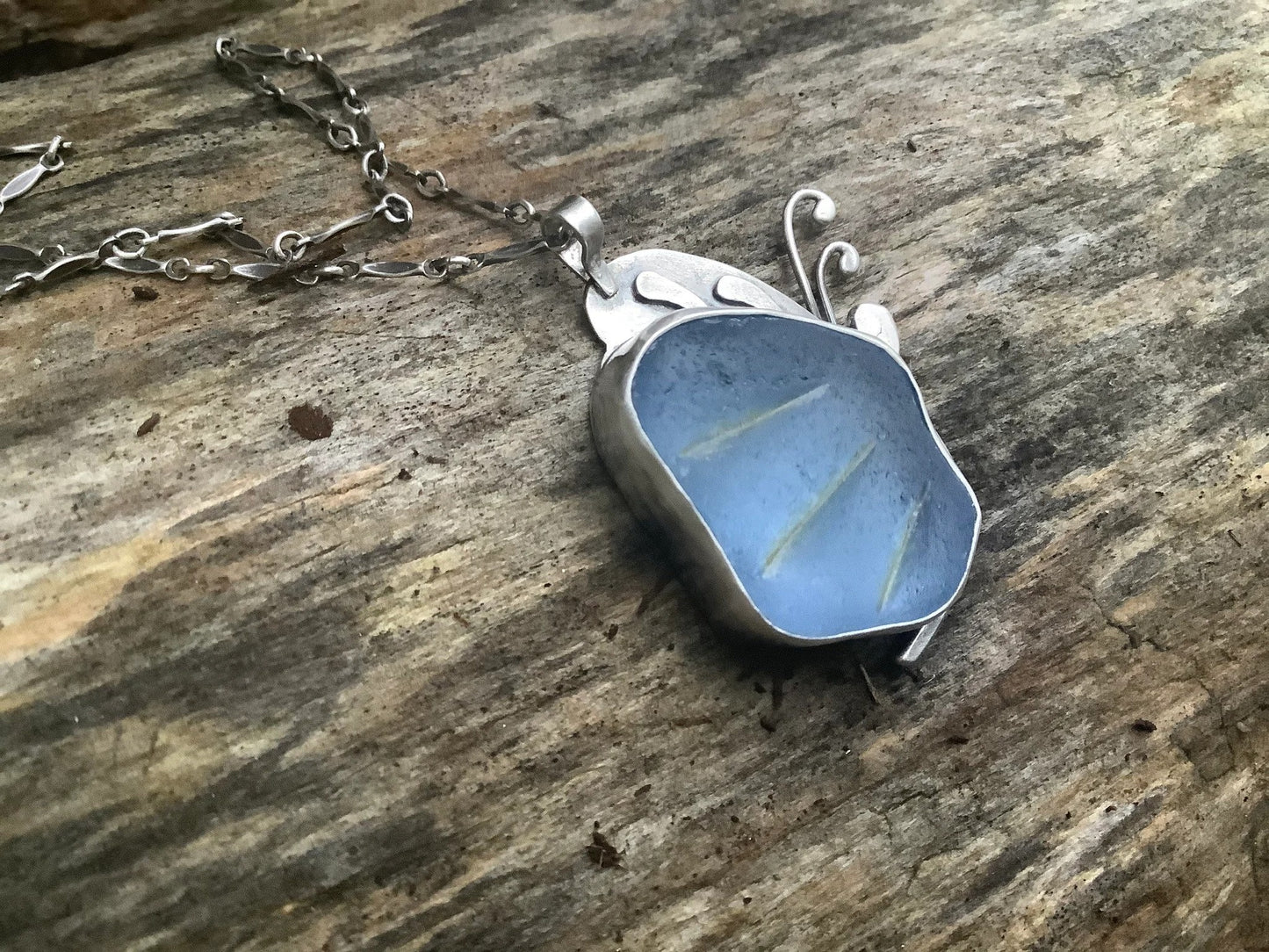 Blue sea glass butterfly pendant