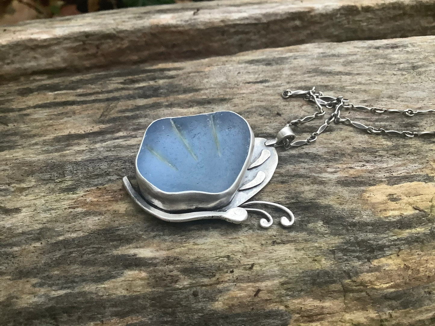 Blue sea glass butterfly pendant